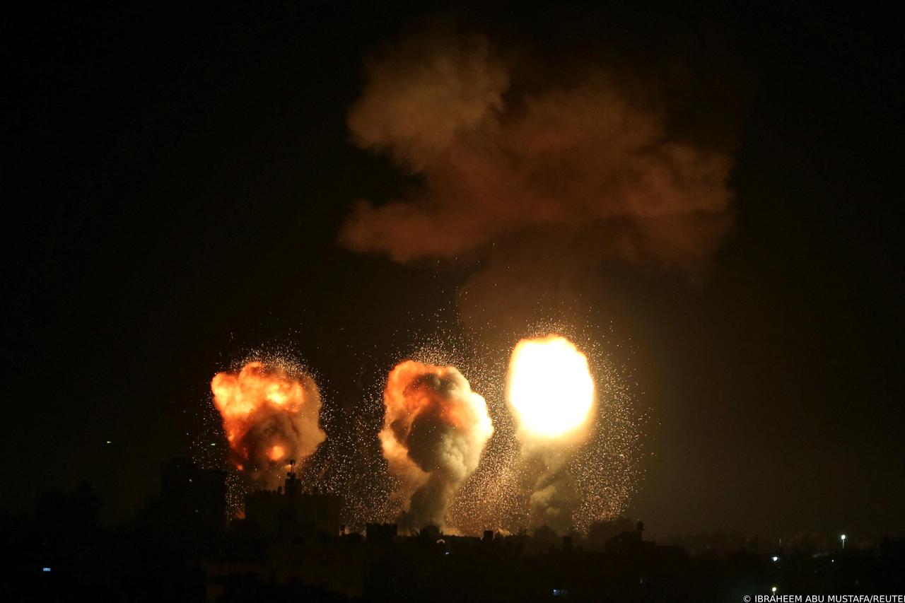 Smoke and flames rise during an Israeli air strike in the Gaza Strip