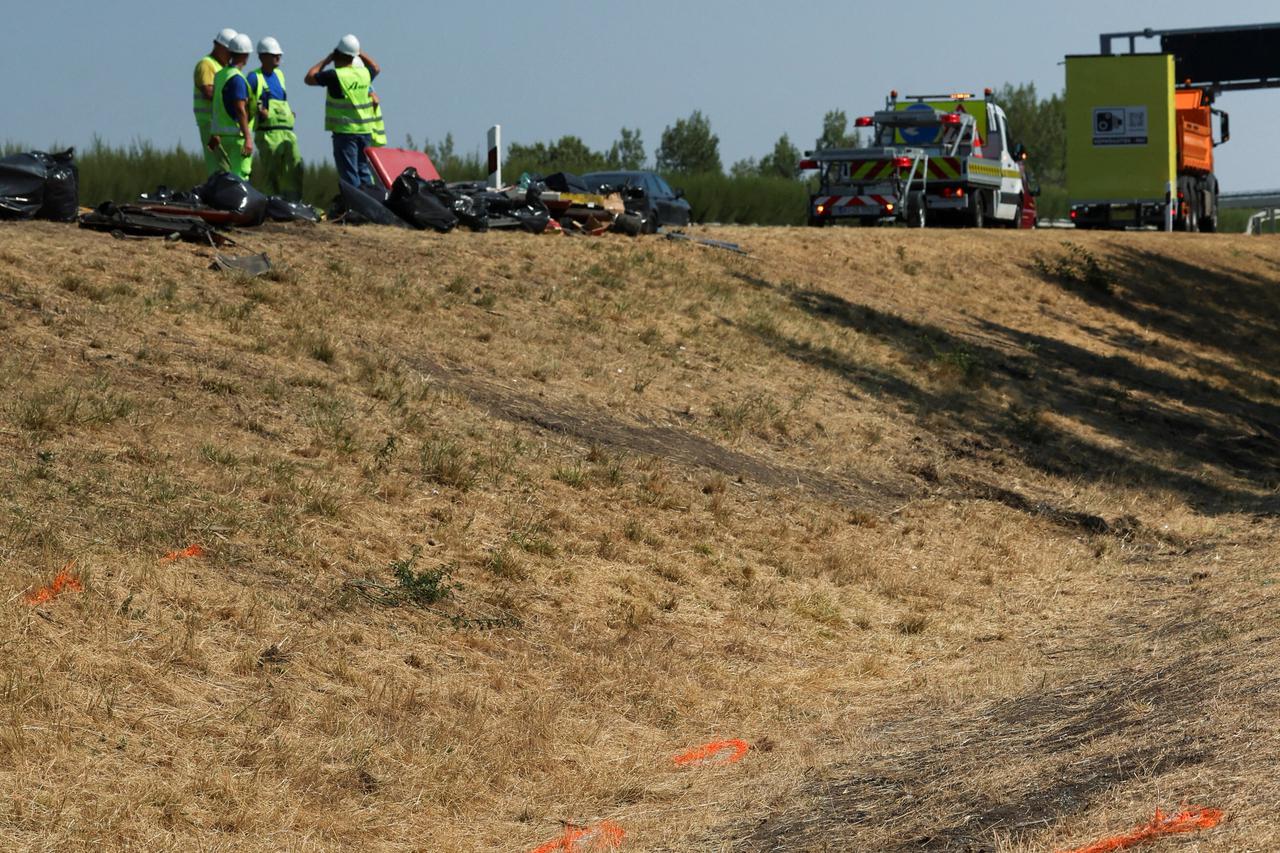 Firefighters work on the scene of a deadly accident near Mezokeresztes