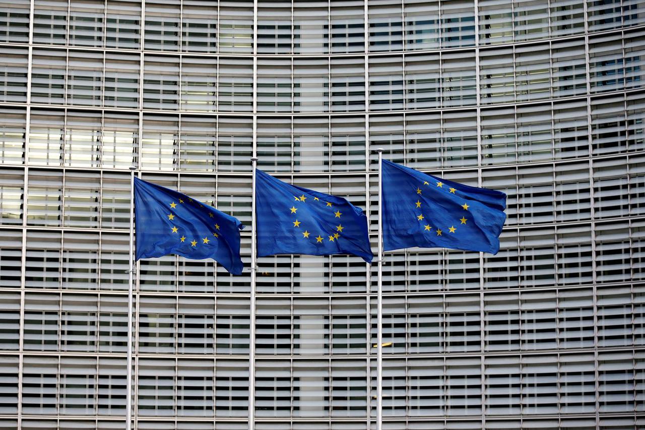 FILE PHOTO: EU flags flutter outside the EU Commission headquarters in Brussels