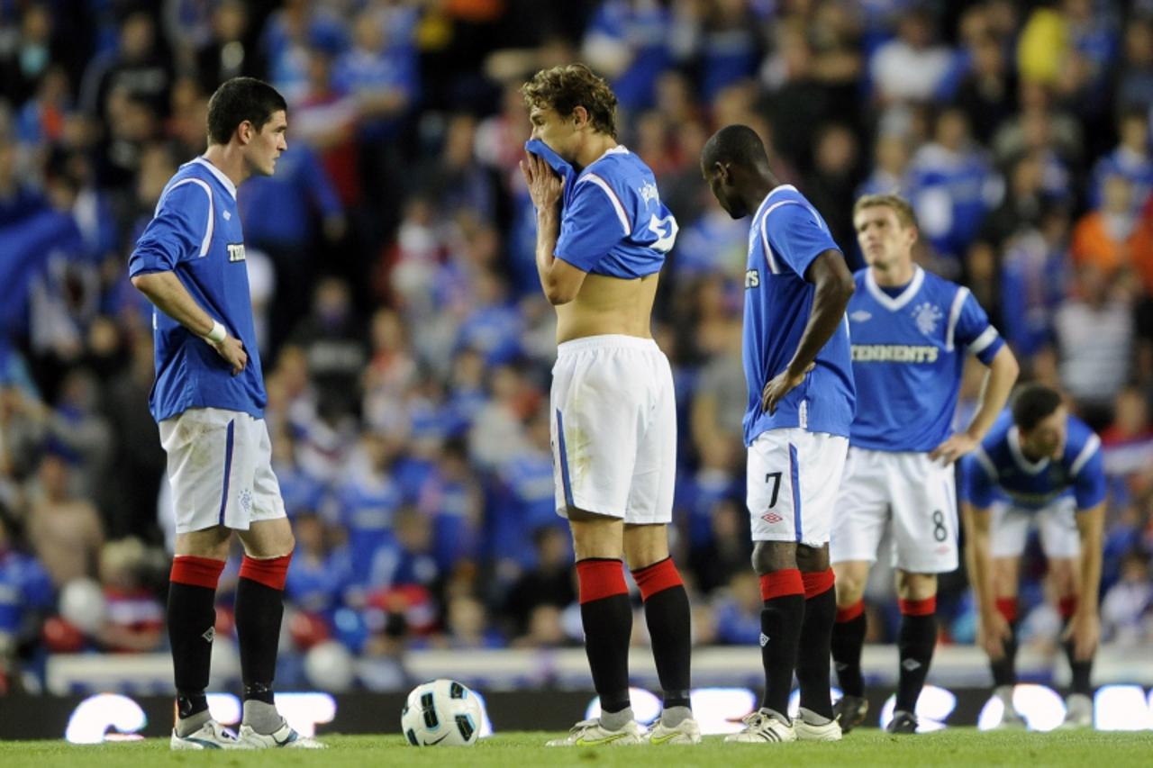 'Rangers\' Kyle Lafferty (L) and Nikica Jelavic prepare to kick off after conceding a goal against Maribor during their Europa League play-off second leg soccer match at Ibrox Stadium in Glasgow, Scot