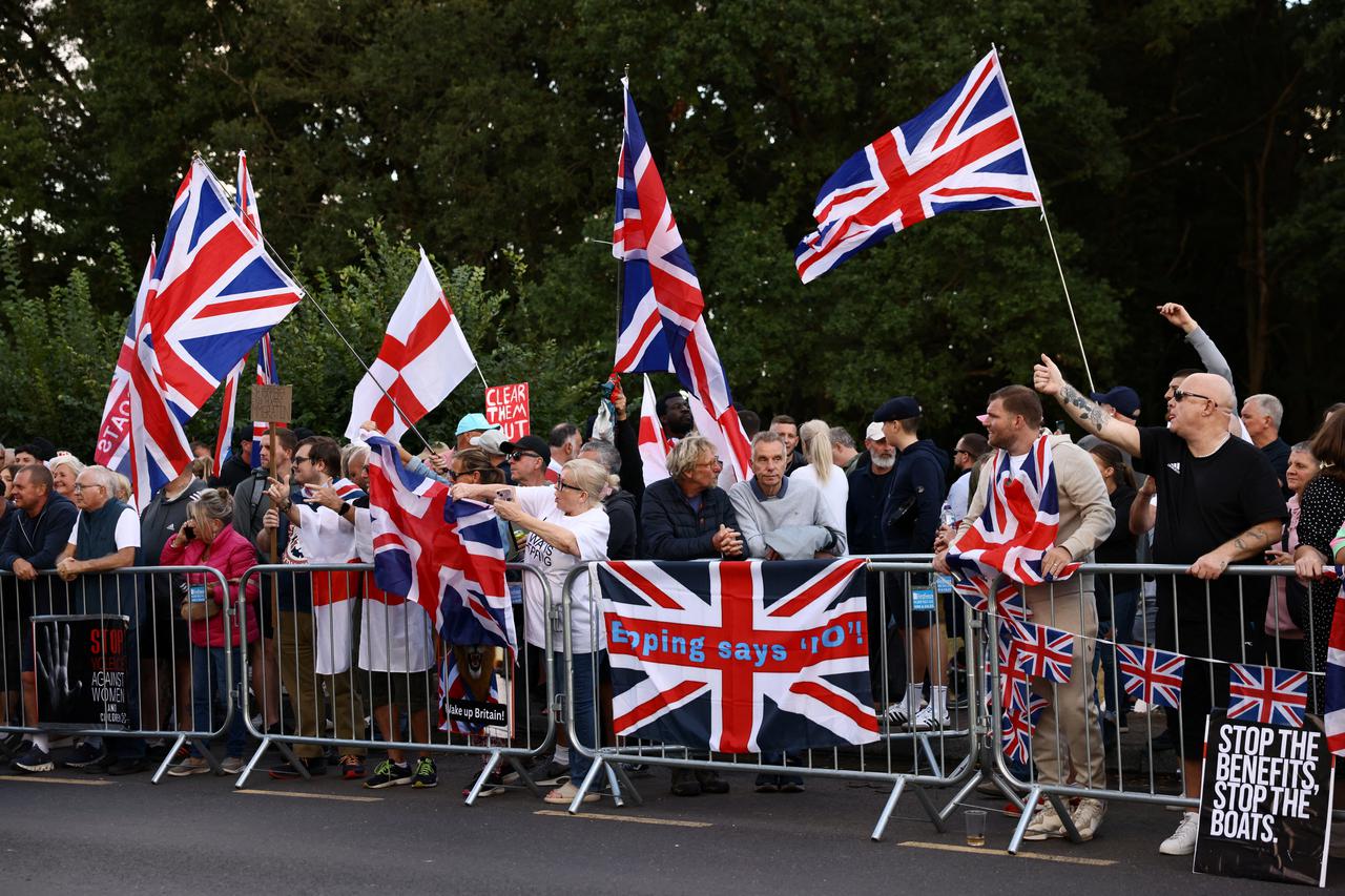 Protesters attend an anti-immigration demonstration outside The Bell Hotel, in Epping