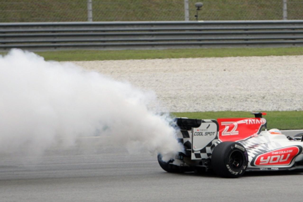 'HRT Formula One driver Narain Karthikeyan of India engines blows during first practise of the Malaysian F1 Grand Prix at the Sepang circuit outside Kuala Lumpur April 8, 2011. REUTERS/Samsul Said (MA