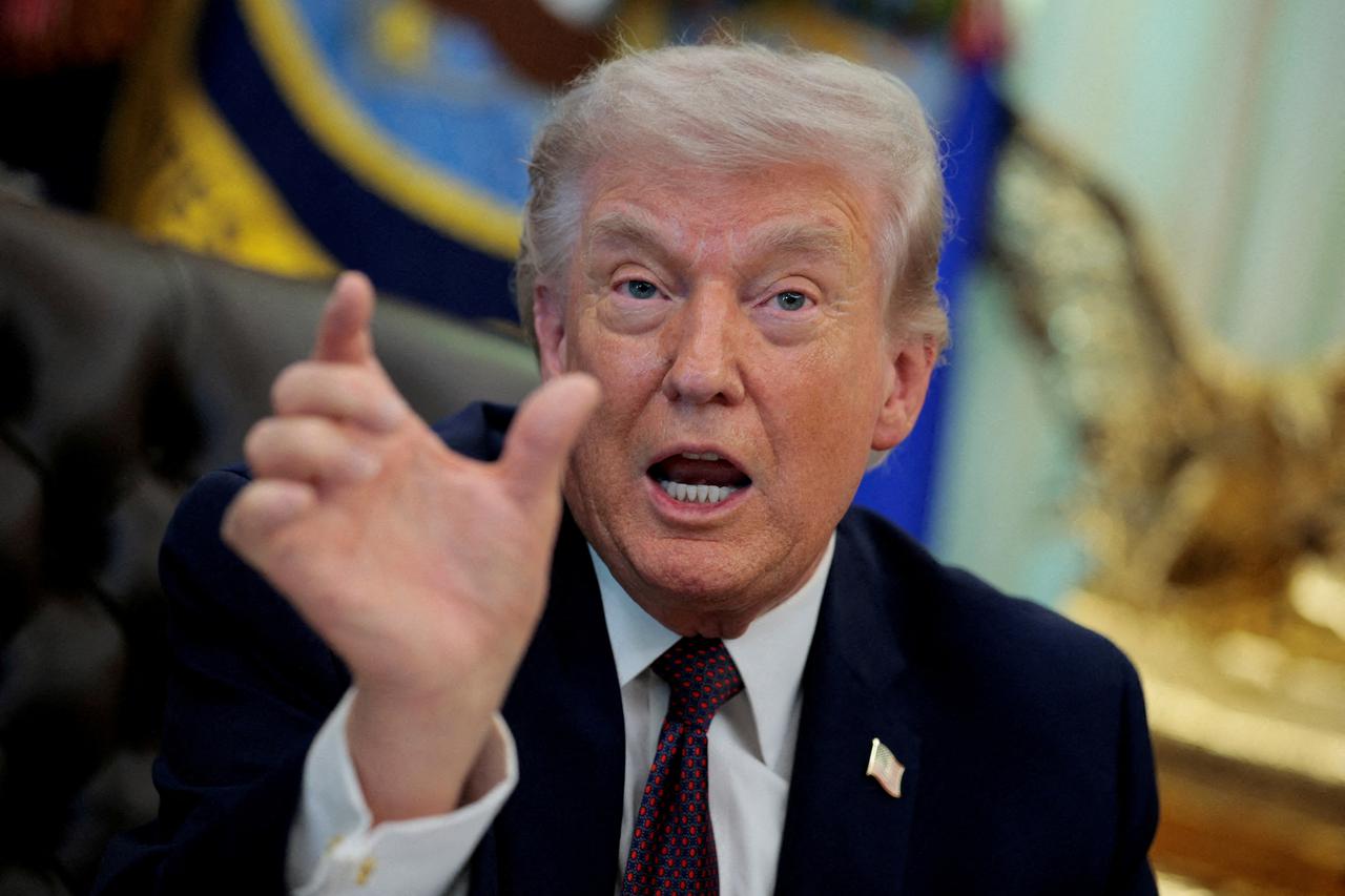 FILE PHOTO: U.S. President Trump signs an executive order in the Oval Office of the White House