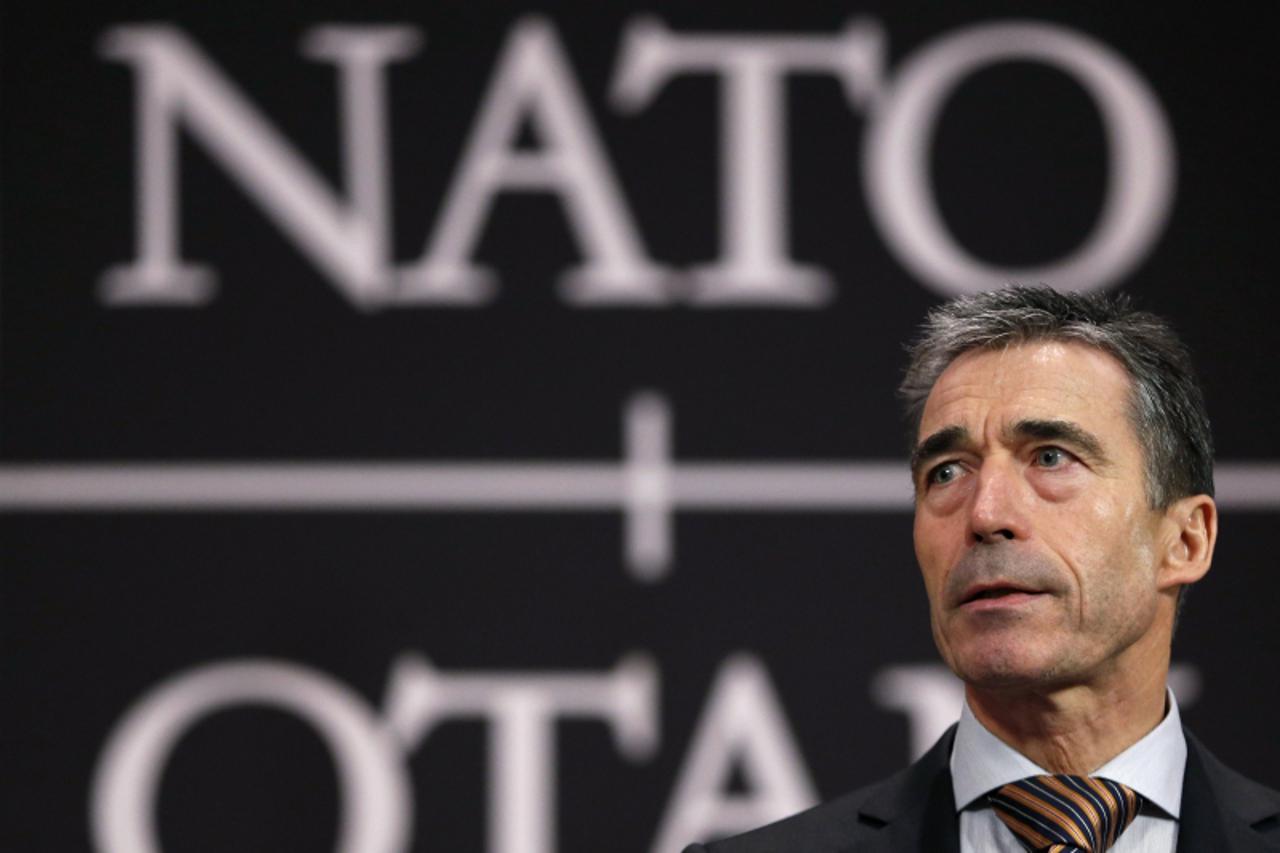 'NATO Secretary General Anders Fogh Rasmussen addresses a news conference during a NATO foreign ministers meeting at the Alliance headquarters in Brussels December 5, 2012. /Francois Lenoir (BE