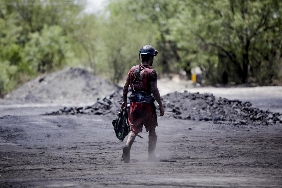 Miners work at an artisanal coal mine in Sabinas