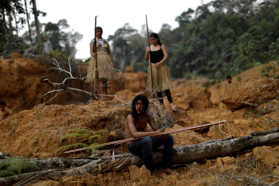 FILE PHOTO: Indigenous people from the Mura tribe show a deforested area in unmarked indigenous lands, inside the Amazon rainforest near Humaita