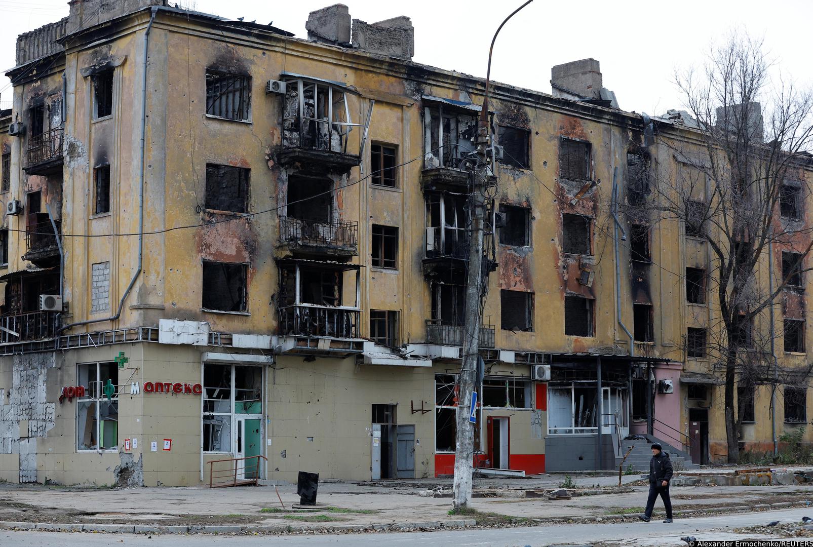 A man walks past a building damaged in the course of Russia-Ukraine conflict in Mariupol, Russian-controlled Ukraine, November 9, 2022. REUTERS/Alexander Ermochenko Photo: Alexander Ermochenko/REUTERS