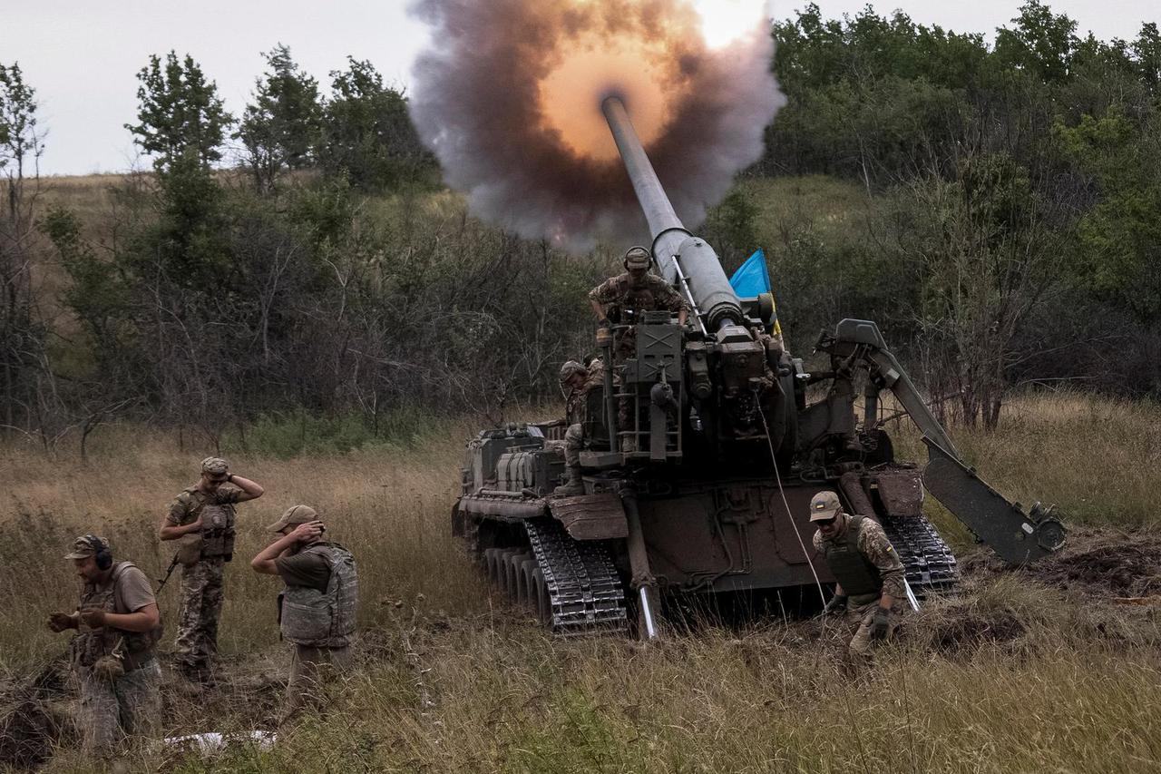 Ukrainian servicemen fire a 2S7 Pion self-propelled gun at a position in Donetsk region