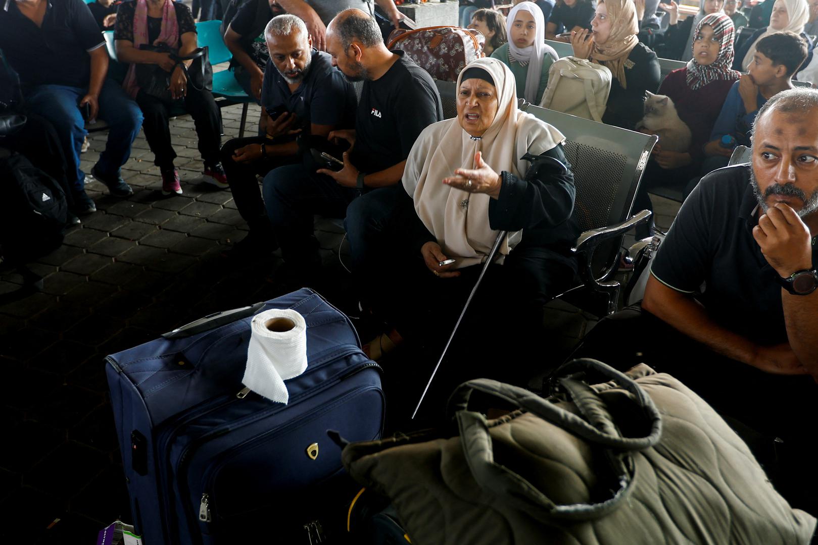 A woman reacts as Palestinians with dual citizenship wait for permission to leave Gaza, amid the ongoing conflict between Israel and Palestinian Islamist group Hamas, at the Rafah border crossing with Egypt, in Rafah in the southern Gaza Strip, November 2, 2023. REUTERS/Ibraheem Abu Mustafa Photo: IBRAHEEM ABU MUSTAFA/REUTERS
