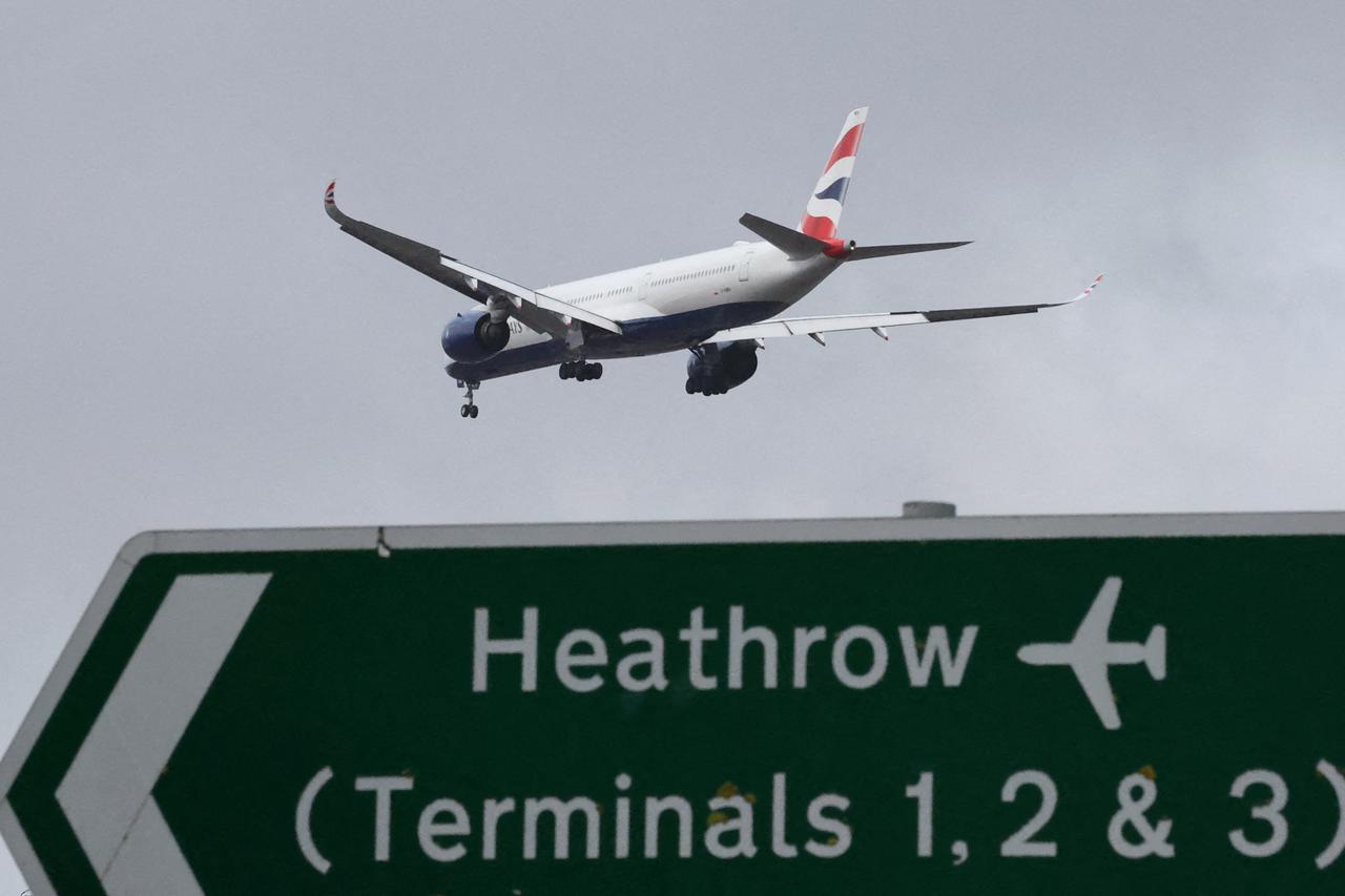 FILE PHOTO: Planes make landing approach to Heathrow Airport in west London