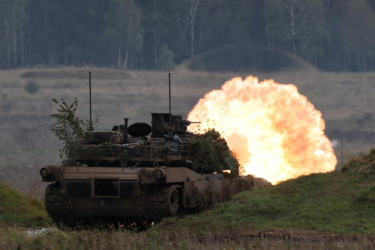 Polish forces with NATO soldiers hold military exercises 'Iron Defender' at Orzysz training ground in Wierzbiny