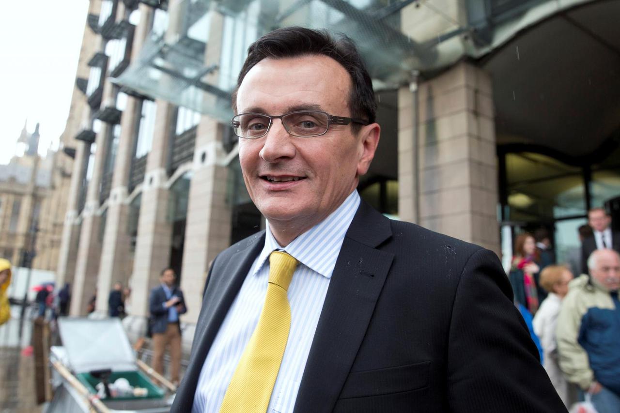 FILE PHOTO: Chief Executive of AstraZeneca Pascal Soriot leaves after appearing at a parliamentary business and enterprise committee hearing at Portcullis House in London