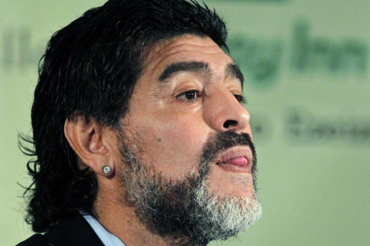 'Argentina soccer great Diego Maradona arrives to read a statement in Buenos Aires in this July 28, 2010 file photo. Maradona was named head coach of Dubai\'s Al Wasl Sport Club on May 16, 2011, in a 