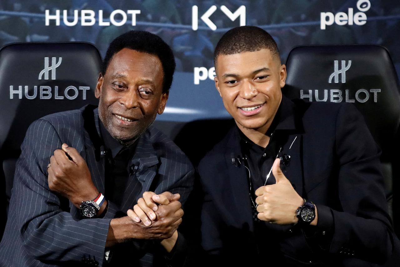 FILE PHOTO: French soccer player Kylian Mbappe and Brazilian soccer legend Pele meet in Paris