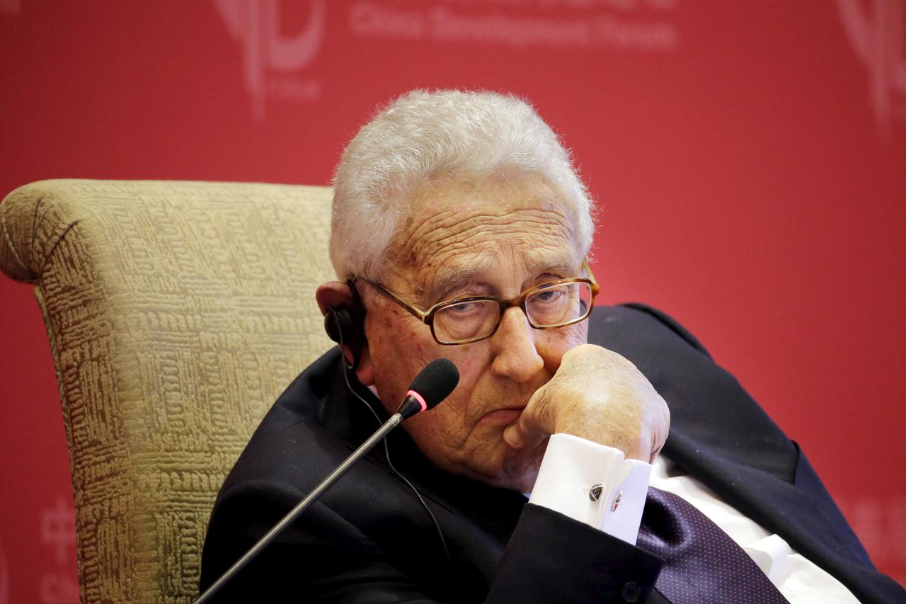 FILE PHOTO: Former U.S. Secretary of State Henry Kissinger listens to a question at China Development Forum in Beijing