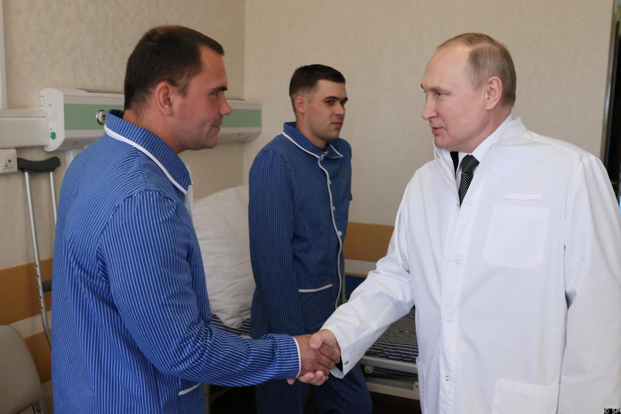 Russian President Vladimir Putin visits soldiers wounded during the conflict in Ukraine at a hospital in Moscow