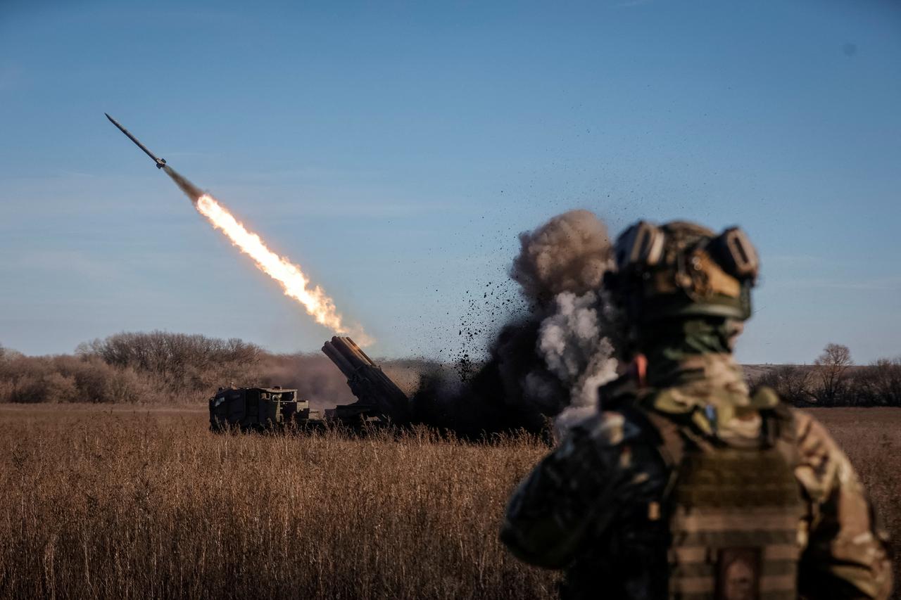 Ukrainian servicemen fire with a Bureviy multiple launch rocket system at a position in Donetsk region