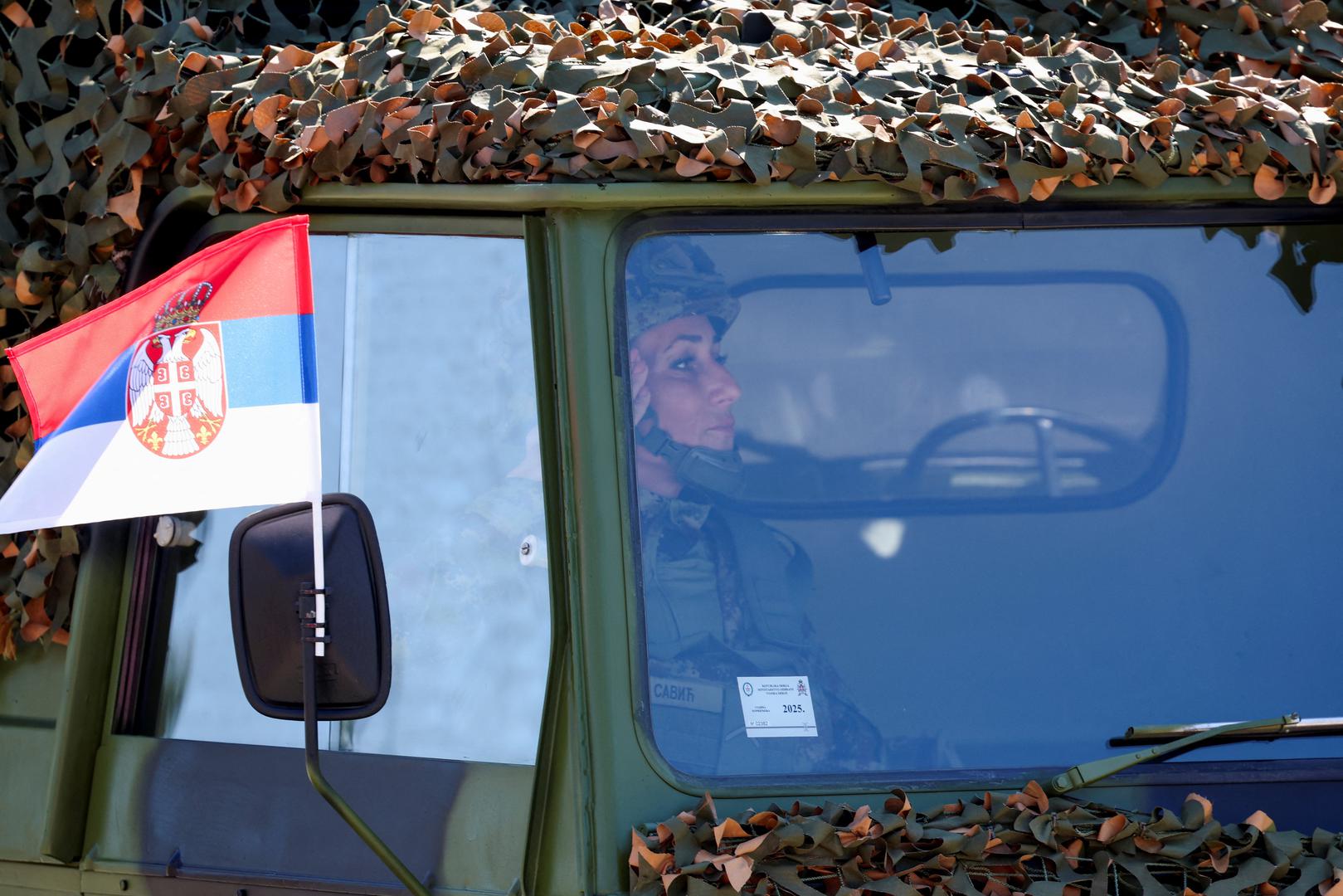 A Serbian army soldier salutes from inside a military vehicle during a military parade in Belgrade, Serbia, September 20, 2025. REUTERS/Zorana Jevtic Photo: ZORANA JEVTIC/REUTERS