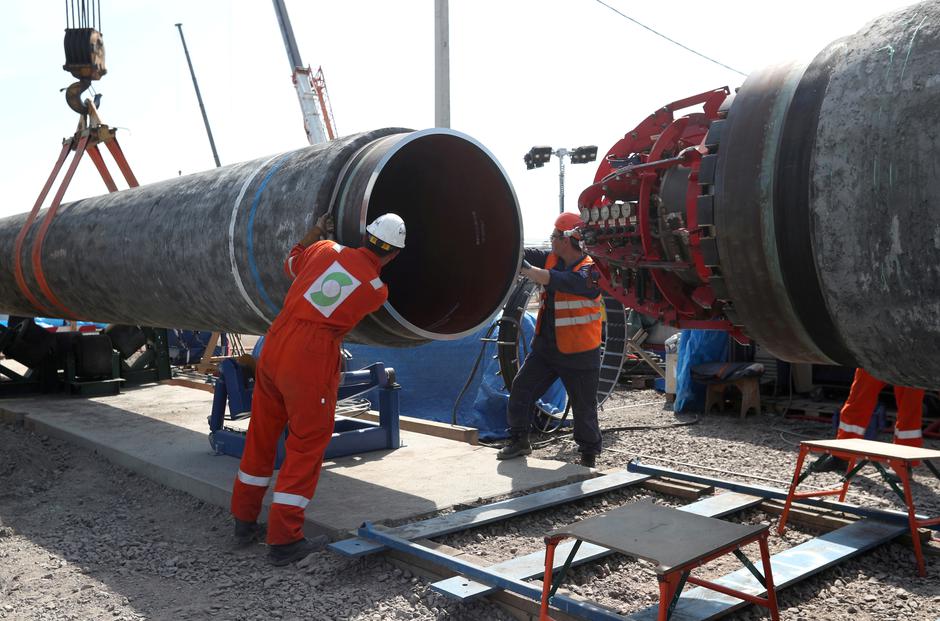 FILE PHOTO: FILE PHOTO: Workers are seen at the construction site of the Nord Stream 2 gas pipeline in Russia