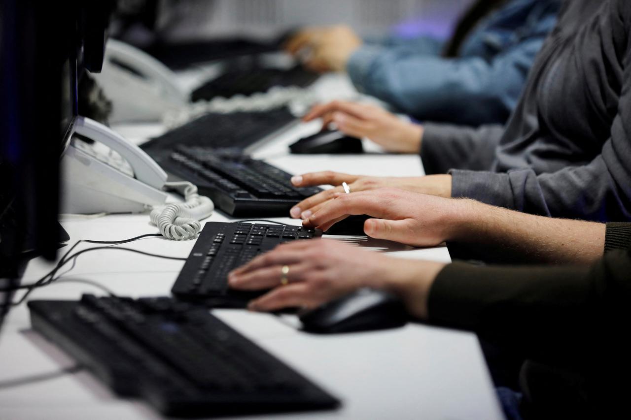 FILE PHOTO: Employees, mostly veterans of military computing units, use keyboards as they work at a cyber hotline facility at Israel's Computer Emergency Response Centre (CERT) in Beersheba, southern Israel