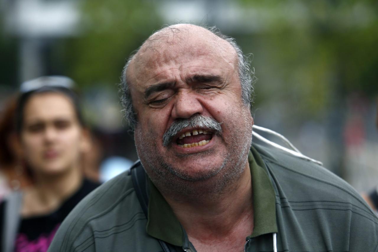 'A blind man shouts anti-government slogans during a protest by Greeks with disabilities against new austerity measures in central Athens September 12, 2012. REUTERS/Yannis Behrakis (GREECE - Tags: CI