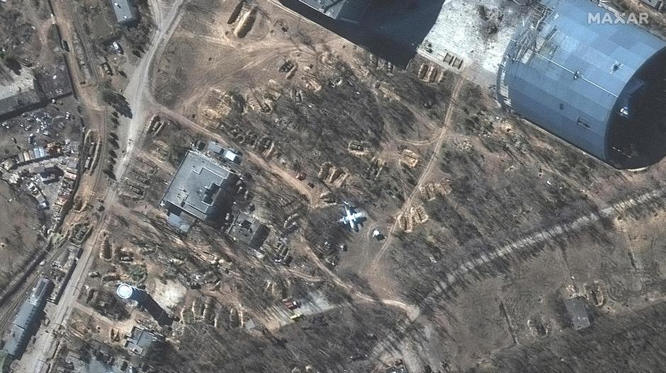 A satellite image shows vehicles in revetments at Antonov Airport in Hostomel