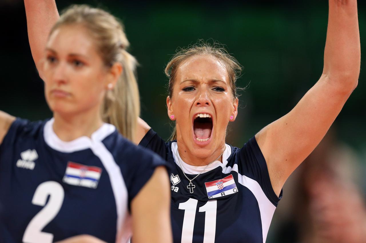 Ana Grbac (L-R) and Sanja Popovic of Croatia celebrate during their women's CEV Volleyball European Championship Playoff match between Croatia and Netherlands at Gerry Weber Stadium in Halle/Westphalia, Germany, 10 September 2013. Photo: Friso Gentsch/dpa