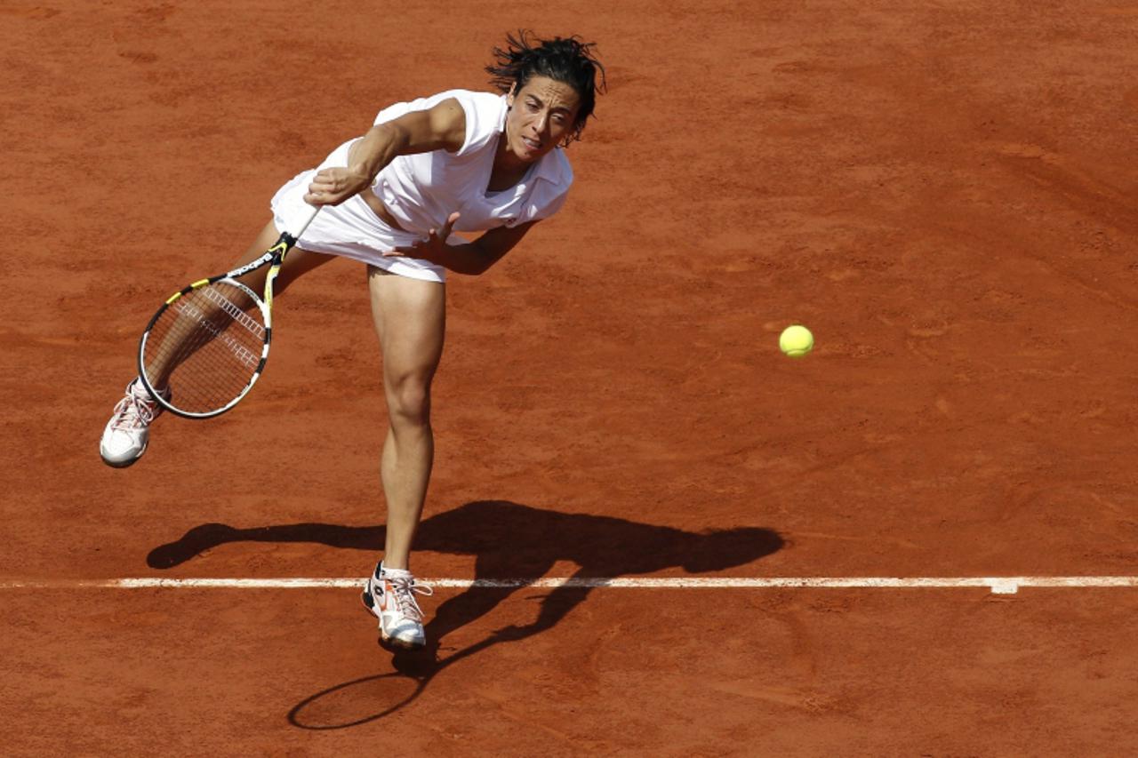 'Italy\'s Francesca Schiavone returns the ball to Australia\'s Samantha Stosur during their women\'s final match  in the French Open tennis championship at the Roland Garros stadium, on June 5, 2010, 