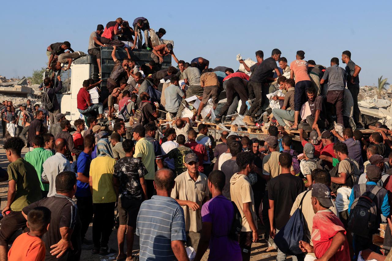 Palestinians seek aid supplies in Khan Younis