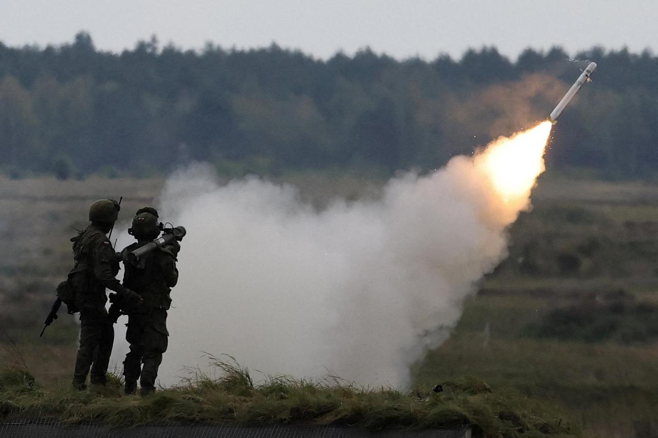 FILE PHOTO: Polish forces with NATO soldiers hold military exercises 'Iron Defender' at Orzysz training ground in Wierzbiny