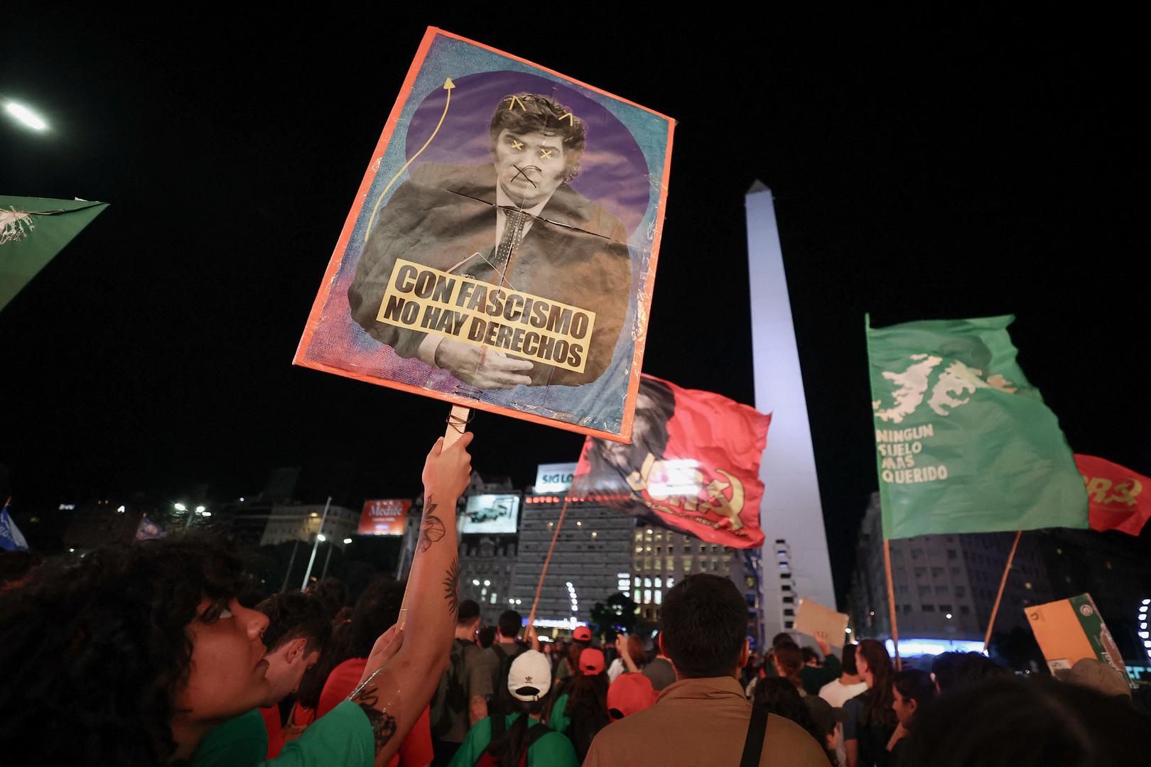 A person holds a sign depicting Argentine President Javier Milei after Argentine university students, unions and social groups gathered near Casa Rosada government house to protest against President Javier Milei's "chainsaw" cuts on public education, in Buenos Aires, Argentina, April 23, 2024. REUTERS/Agustin Marcarian Photo: AGUSTIN MARCARIAN/REUTERS