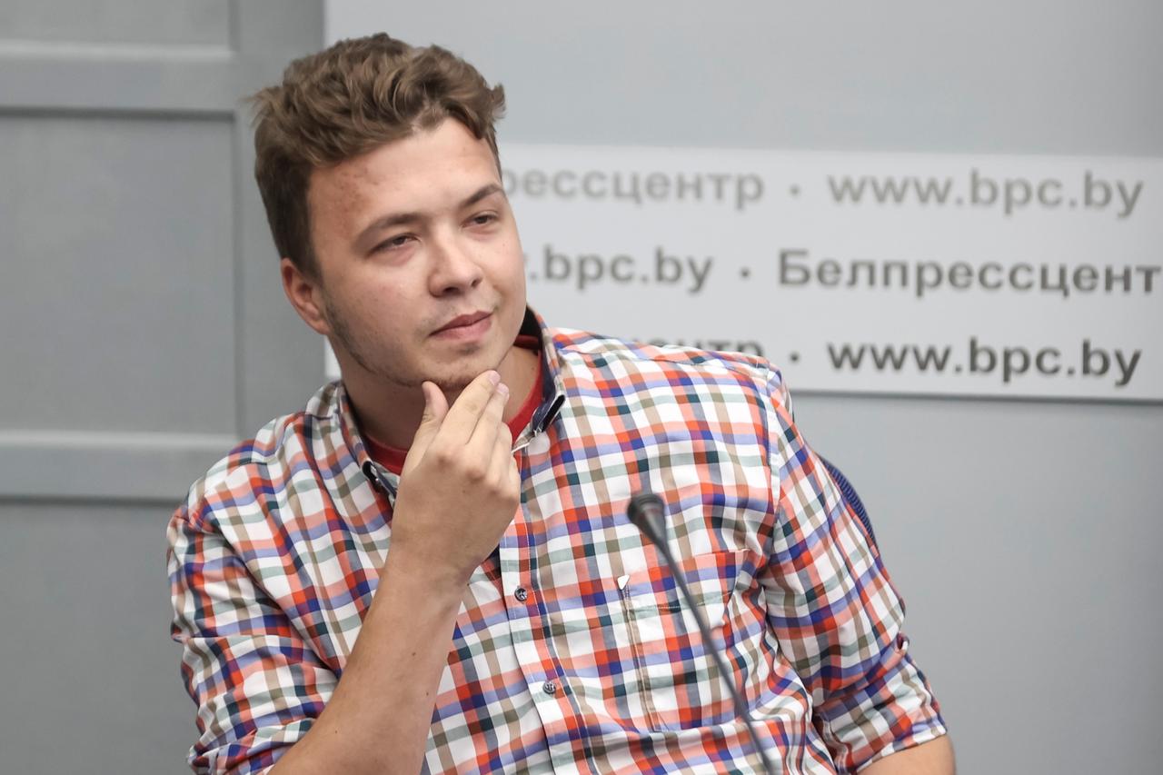 Jailed Belarus journalist Roman Protasevich takes part in a press conference in Minsk