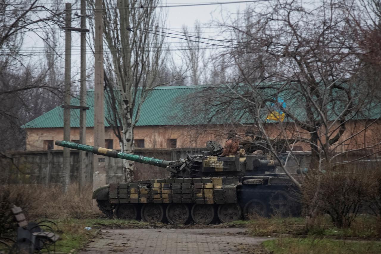 Ukrainian servicemen ride a tank in Bakhmut
