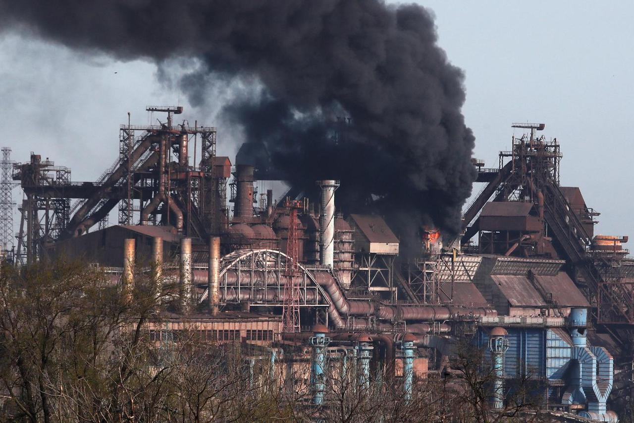Smoke rises above a plant of Azovstal Iron and Steel Works in Mariupol