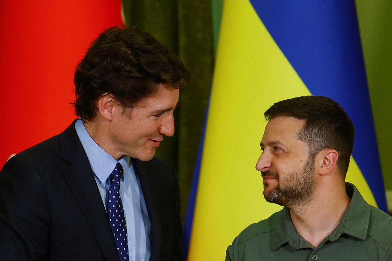 Canadian Prime Minister Trudeau and Ukraine's President Zelenskiy speak as they shake hands during press conference in Kyiv