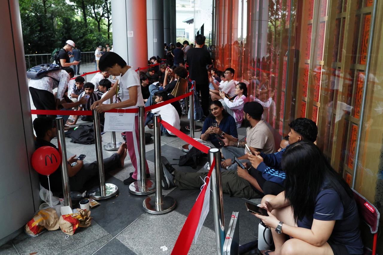 People queue to buy Audemars Piguet & Swatch “Royal Pop” watches in Singapore