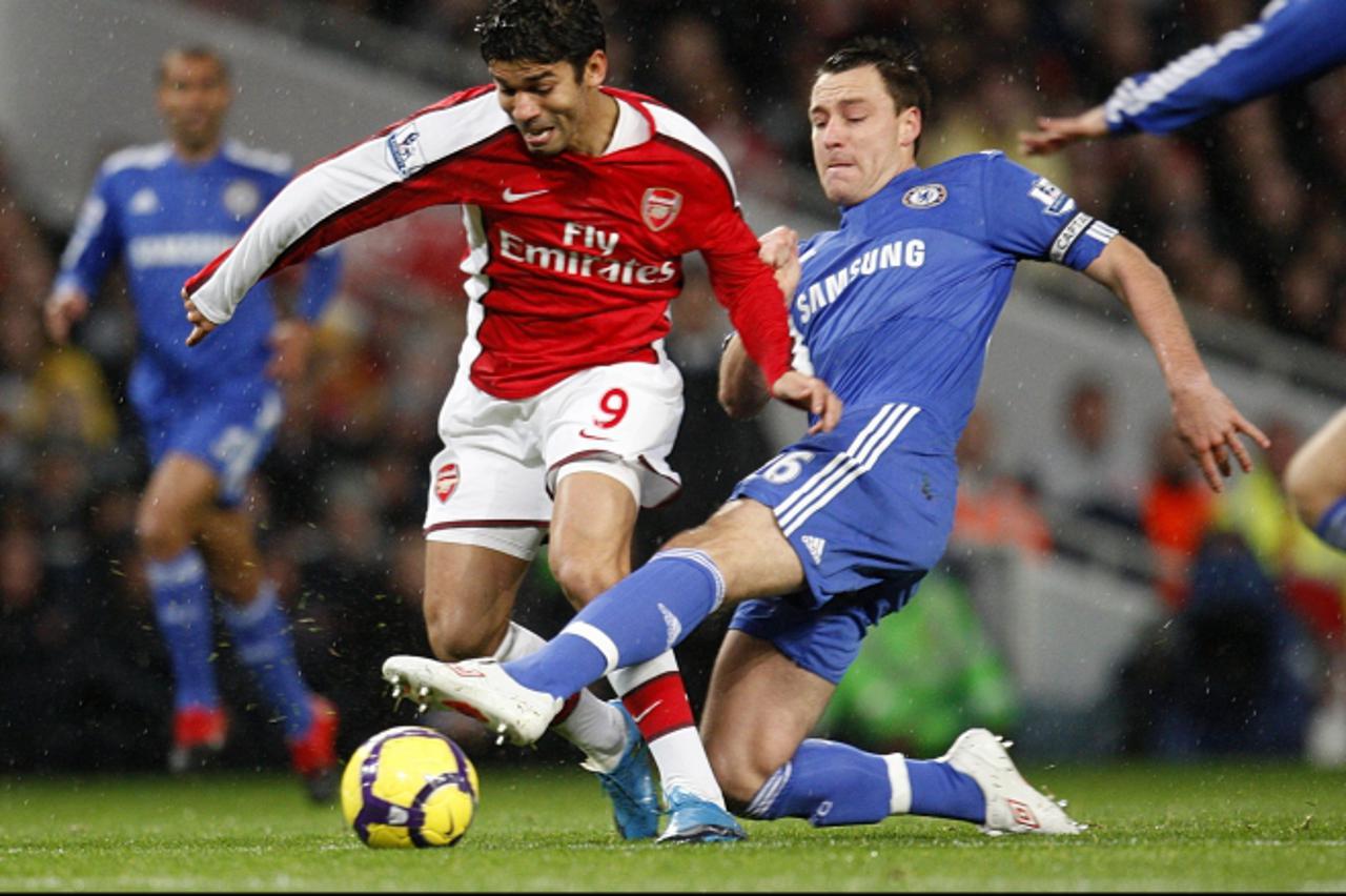 'Chelsea\'s John Terry (right) and Arsenal\'s Da Silva Eduardo (left) battle for the ball Photo: Press Association/Pixsell'