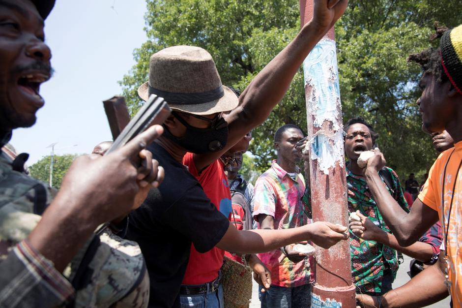 FILE PHOTO: People make noise during a protest against an epidemic of kidnappings sweeping Haiti, in Port-au-Prince