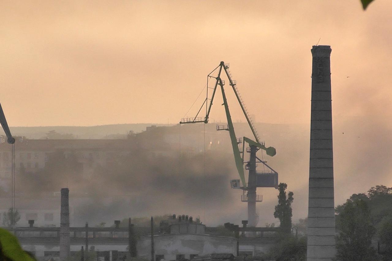 Smoke rises from the shipyard that was reportedly hit by Ukrainian missile attack in Sevastopol