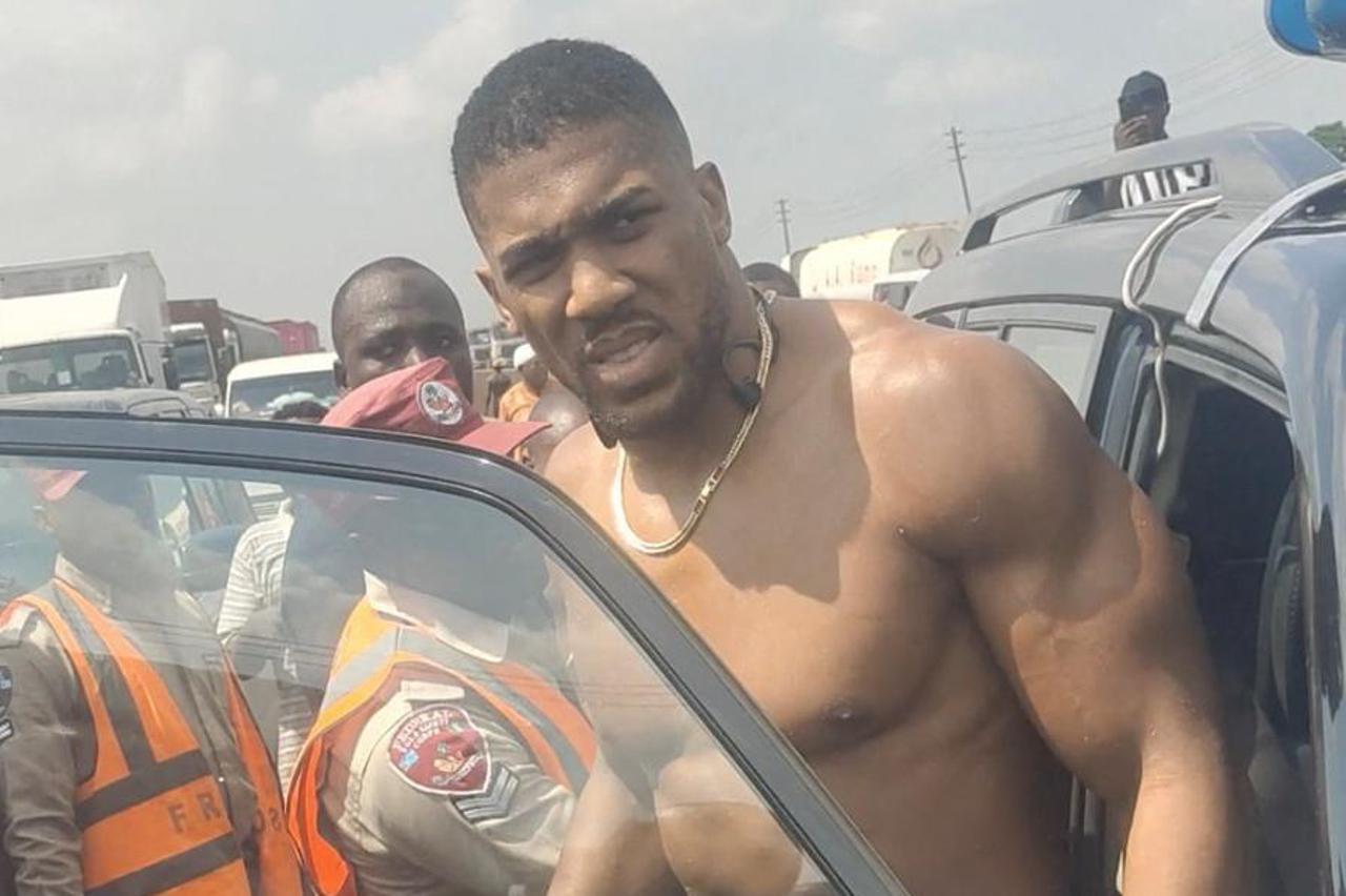British boxer Anthony Joshua gets into an emergency responders' vehicle after being involved in a car crash in Nigeria's Ogun State