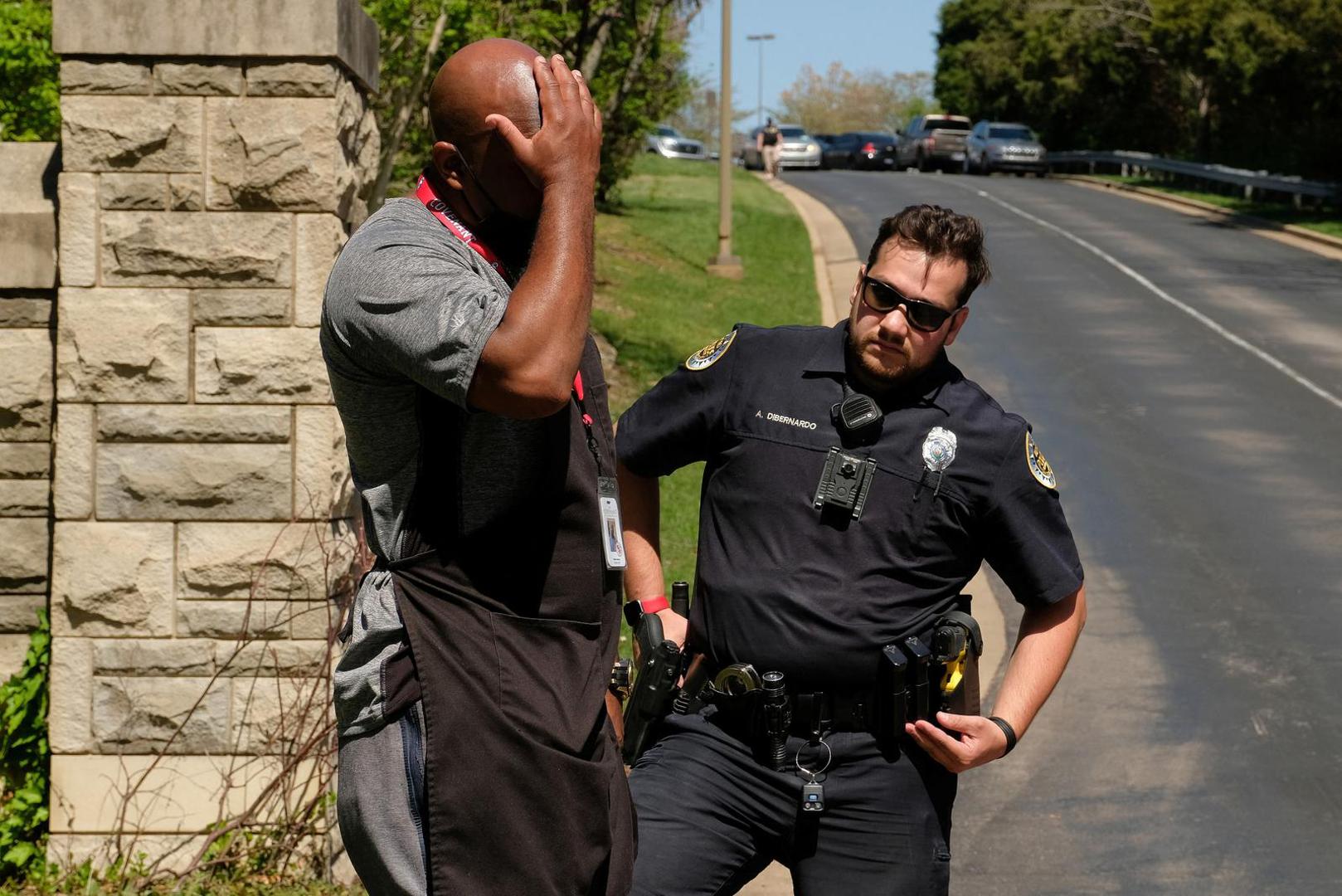 Mario Dennis, one of the kitchen staff at the Covenant School, reacts near a police officer after a shooting at the facility in Nashville, Tennessee, U.S. March 27, 2023.  REUTERS/Kevin Wurm  NO RESALES. NO ARCHIVES Photo: KEVIN WURM/REUTERS