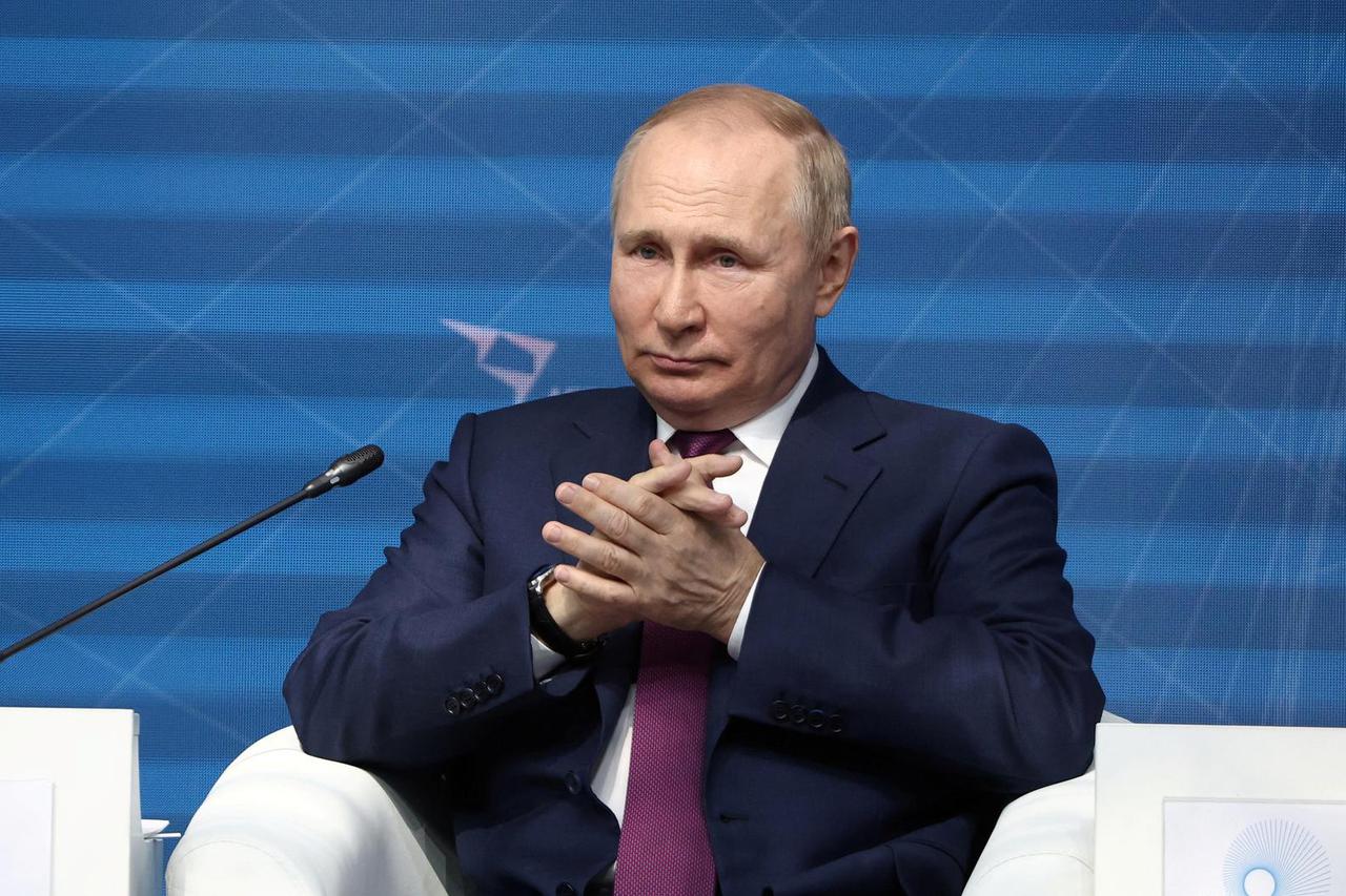 Russian President Vladimir Putin attends a plenary session at the Strong Ideas for a New Time forum in Moscow