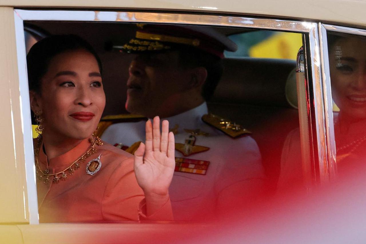 FILE PHOTO: Thailand's King Maha Vajiralongkorn, Queen Suthida and Princess Bajrakitiyabha arrive before a religious ceremony at The Grand Palace in Bangkok
