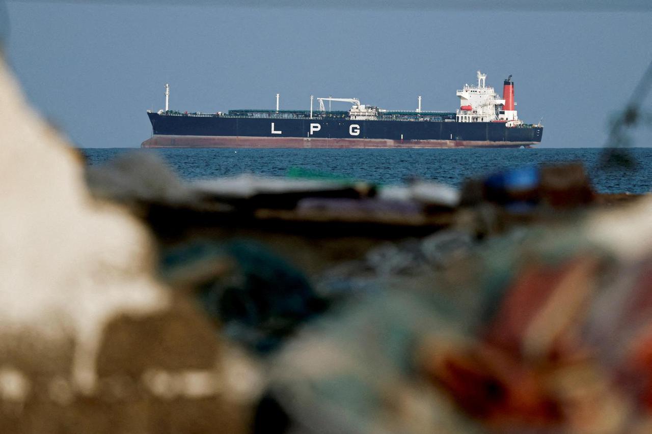 FILE PHOTO: An LPG gas tanker at anchor as traffic is down in the Strait of Hormuz, in Shinas