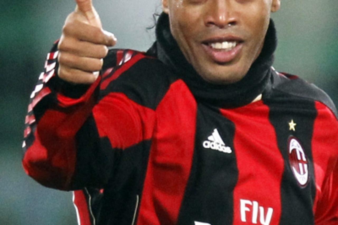 \'AC Milan\'s Ronaldinho gives a thumbs up after scoring during their Champions League Group G soccer match against AJ Auxerre at Abbe Deschamps\' stadium in Auxerre November 23, 2010. REUTERS/Charles