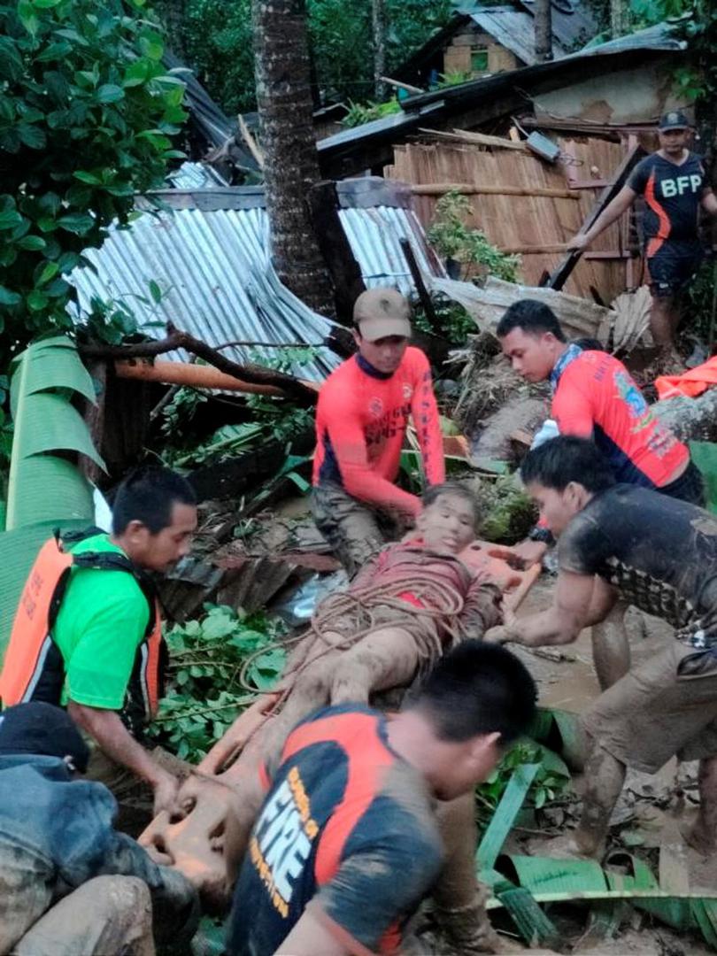 Rescuers carry a person injured in a landslide caused by the tropical storm Megi in Leyte Province, Philippines April 11, 2022. Picture taken April 11, 2022. Philippine Coast Guard/Handout via REUTERS  THIS IMAGE HAS BEEN SUPPLIED BY A THIRD PARTY. MANDATORY CREDIT. NO RESALES. NO ARCHIVES Photo: Philippine Coast Guard/REUTERS