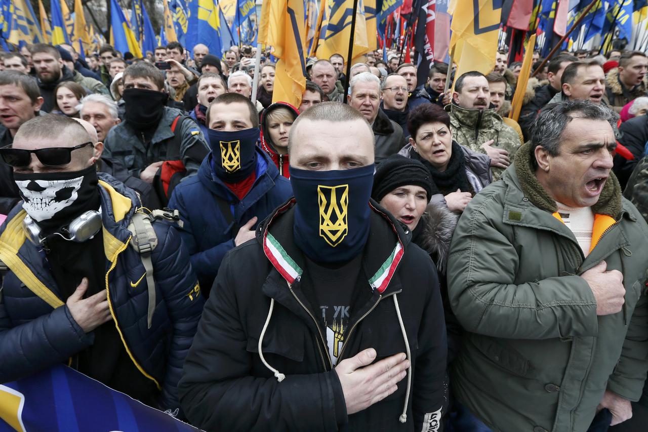 Activists of nationalist groups and their supporters take part in the so-called March of Dignity, marking the third anniversary of the 2014 Ukrainian pro-European Union (EU) mass protests, in Kiev, Ukraine, February 22, 2017. REUTERS/Valentyn Ogirenko  TP
