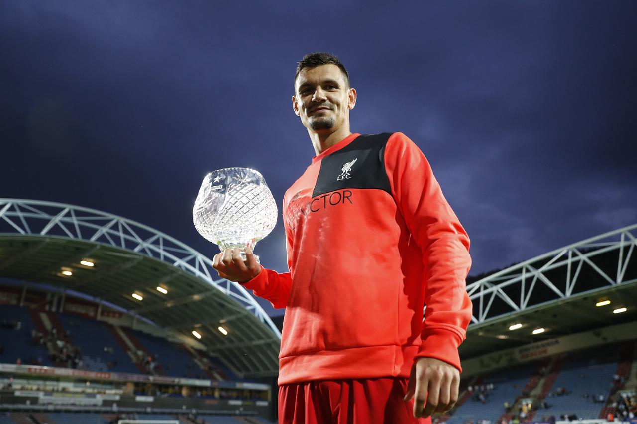 Britain Football Soccer - Huddersfield Town v Liverpool - Pre Season Friendly - John Smith's Stadium - 20/7/16 Liverpool's Dejan Lovren celebrates with the Shankly Trophy at the end of the match Action Images via Reuters / Carl Recine Livepic 