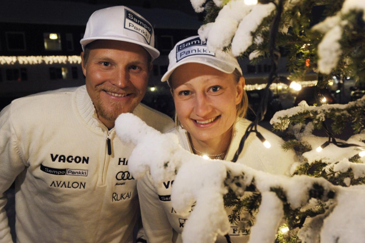 'Finnish alpine skiers Kalle Palander (L) and Tanja Poutiainen (R) pose after the Finnish Alpine Ski Team\'s press conference in Levi on November 11, 2010 prior the FIS Alpine Ski World Cup slalom eve