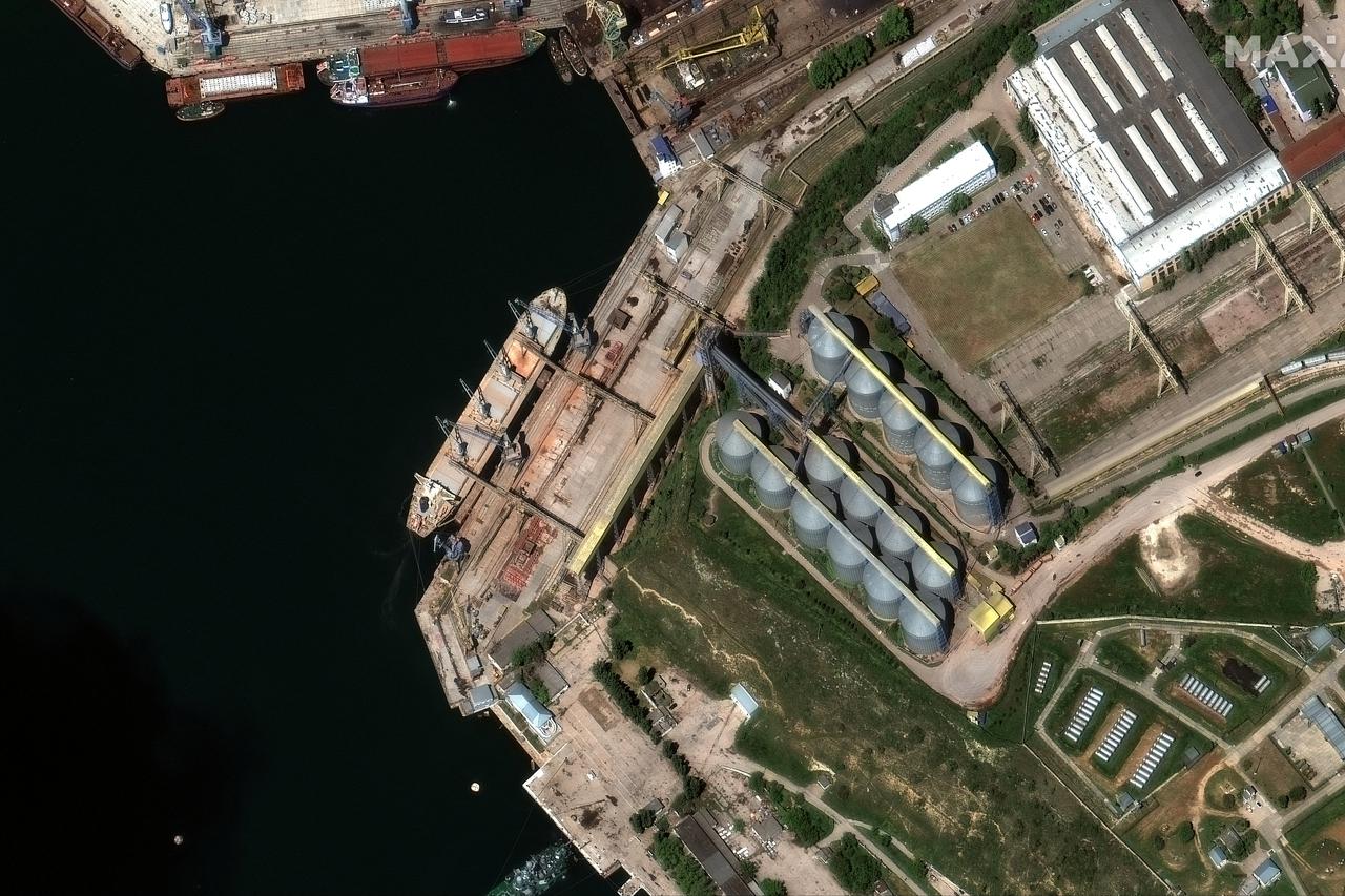 A satellite image shows a bulk carrier ship loading grain at the port of Sevastopol